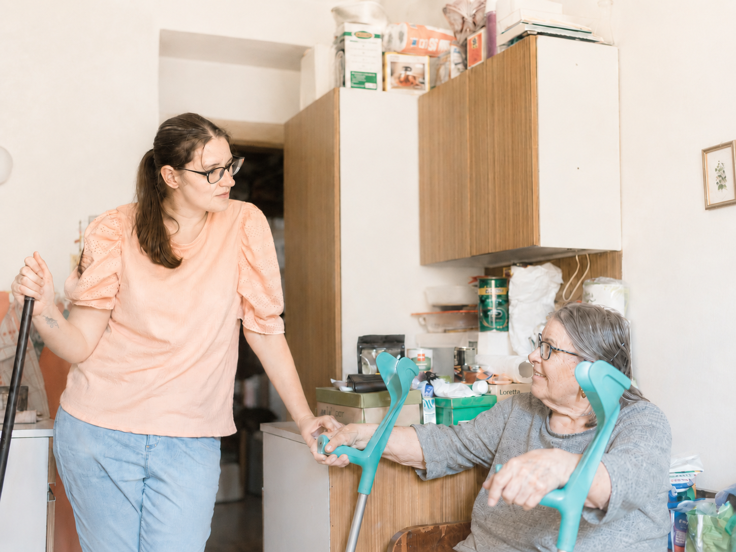 A care worker talking with an older adult during a home companionship visit